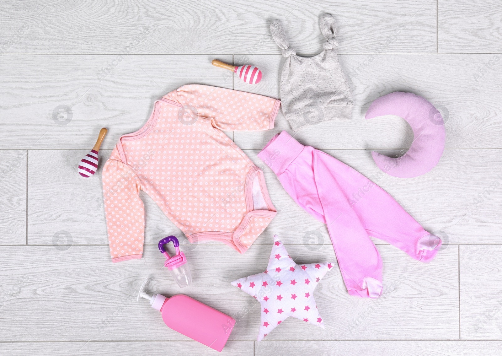 Photo of Flat lay composition with stylish child clothes on light background