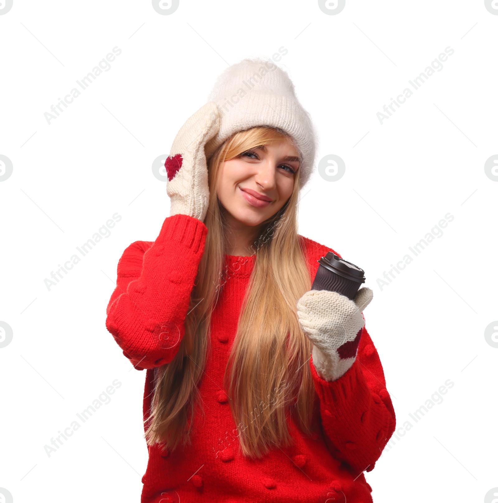 Photo of Portrait of young woman in stylish hat and sweater with paper coffee cup on white background. Winter atmosphere