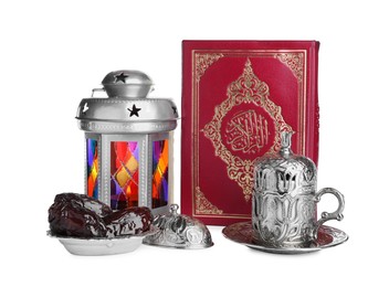 Decorative Arabic lantern, Quran, dates and coffee on white background