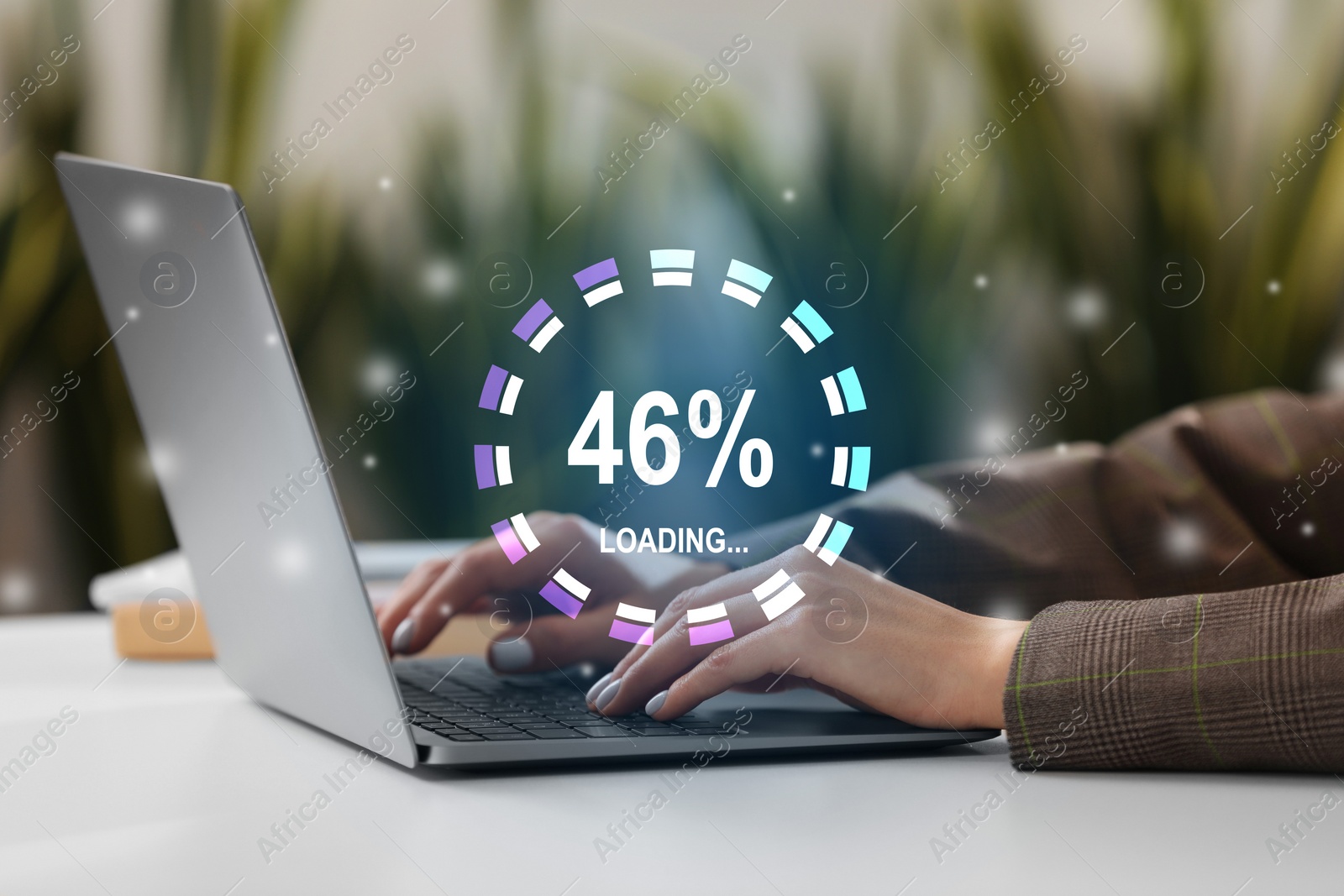 Image of Loading progress. Woman working on laptop at table indoors, closeup