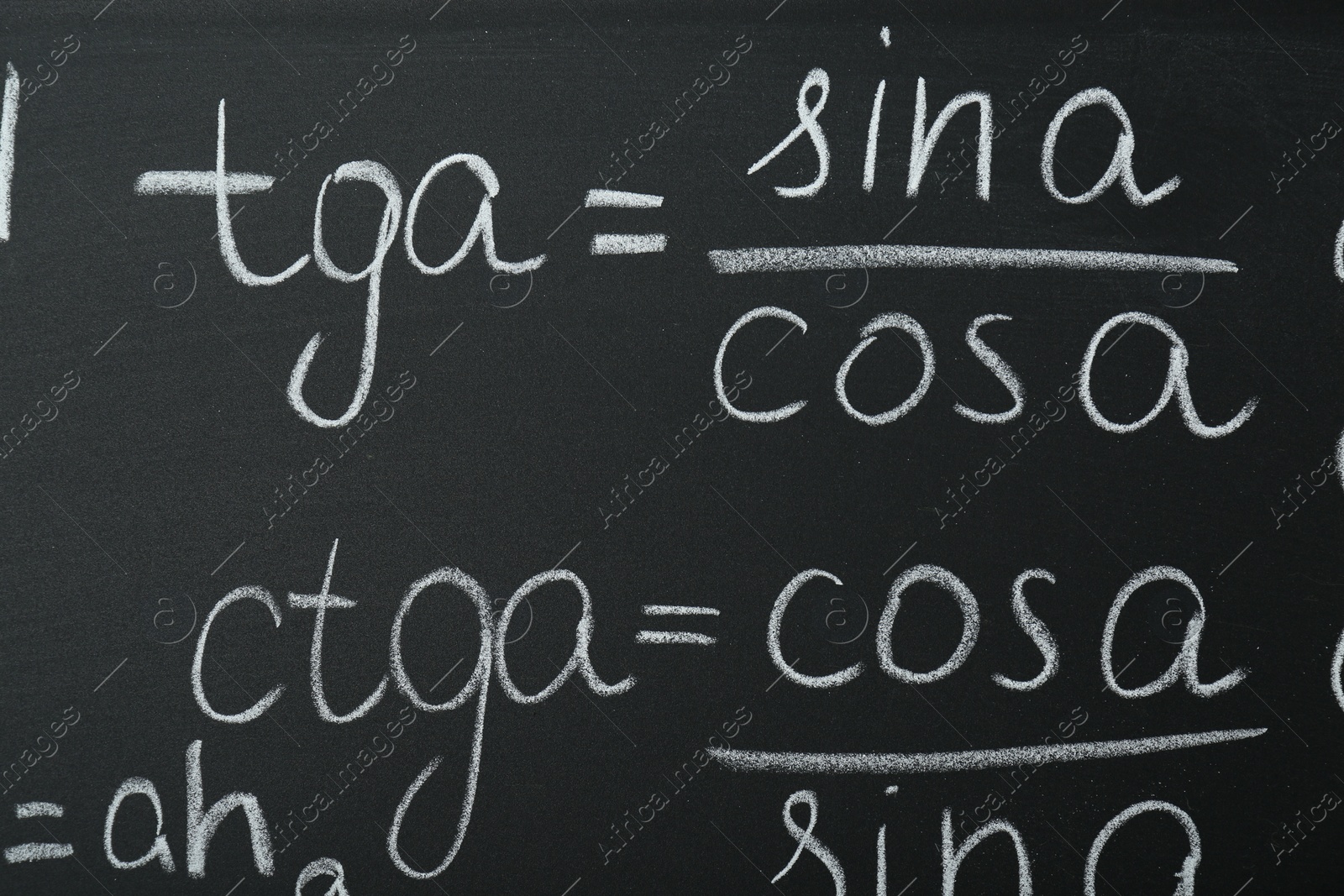 Photo of Many different math formulas written on chalkboard, closeup