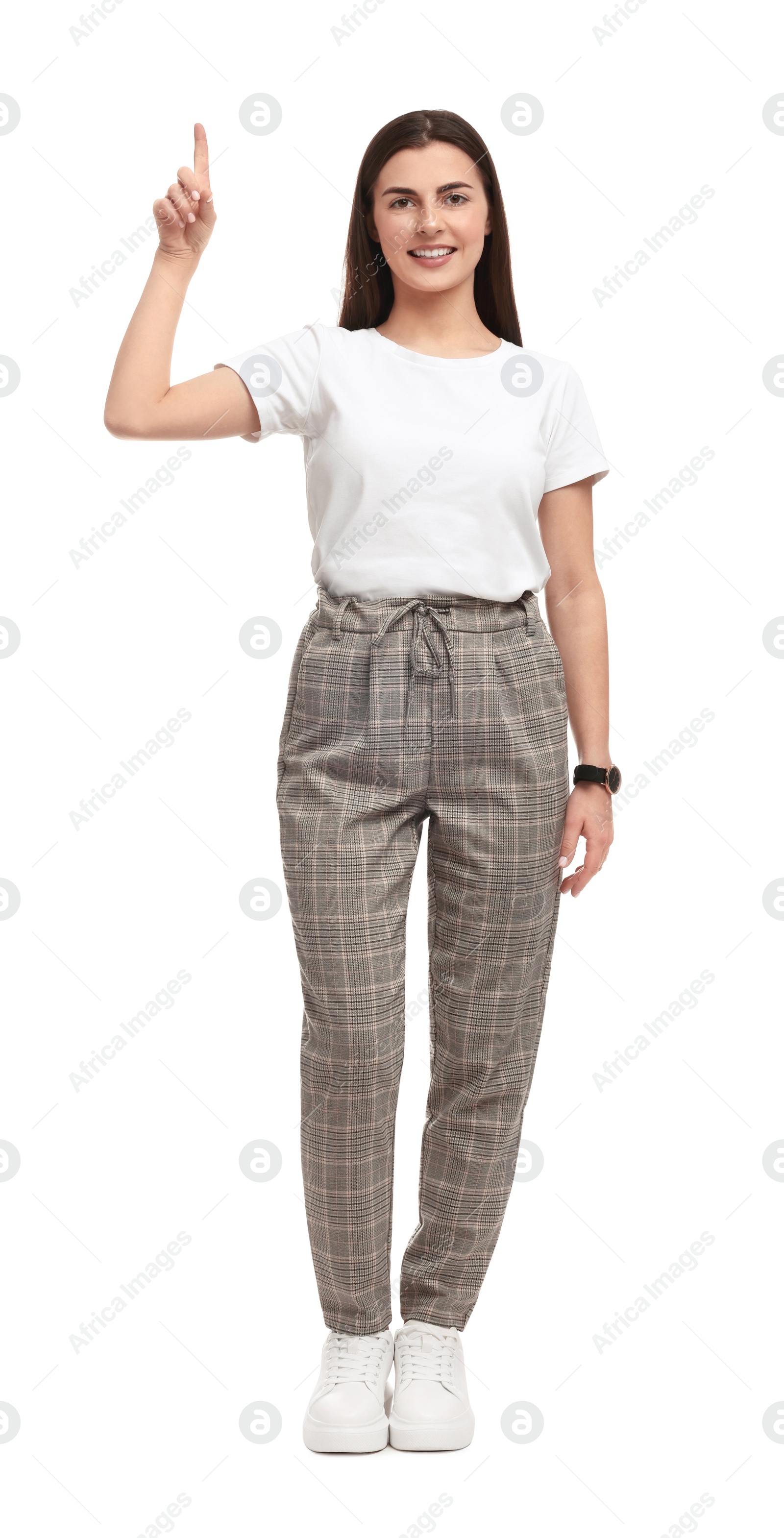 Photo of Beautiful happy businesswoman pointing at something on white background