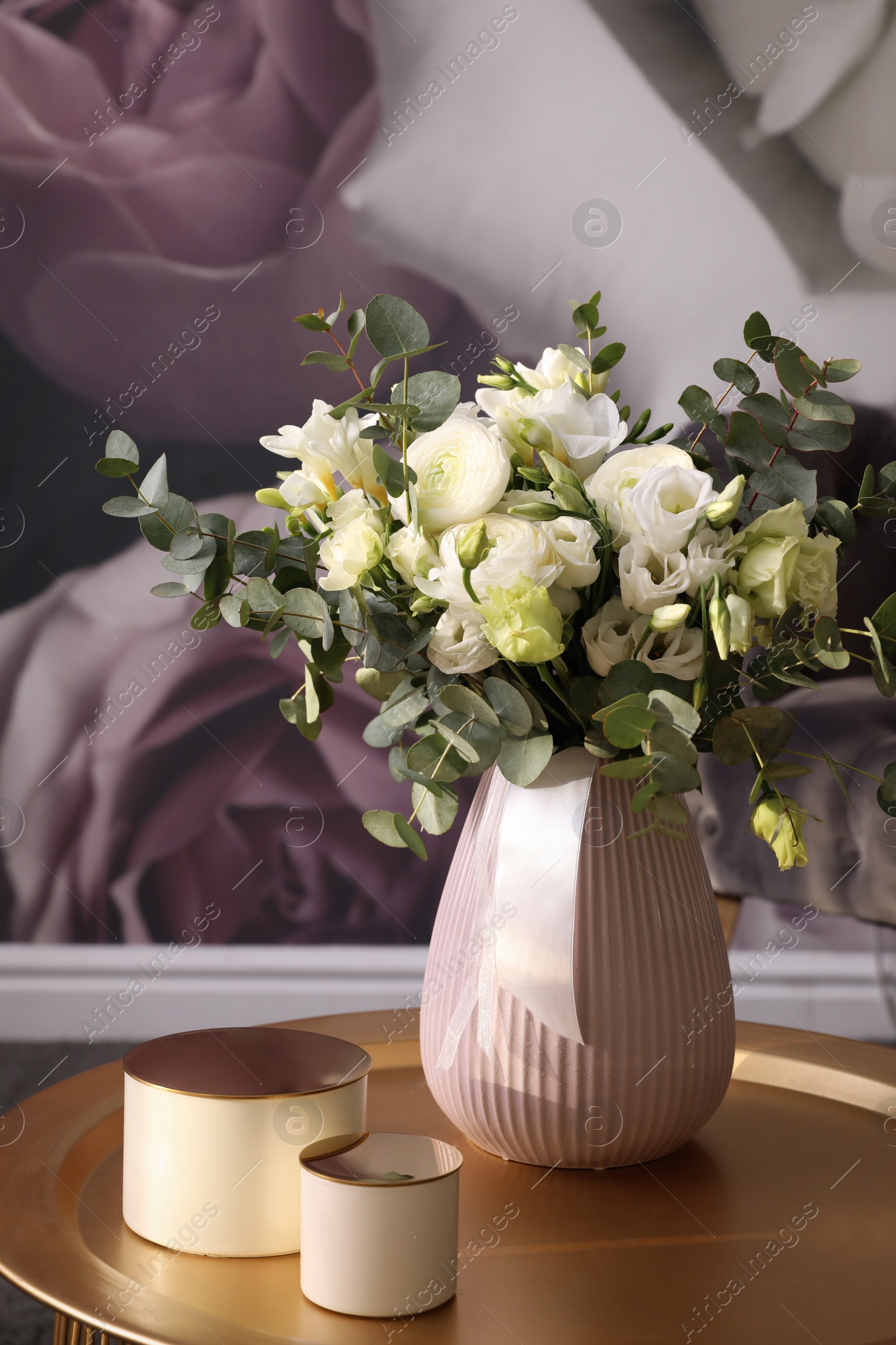 Photo of Beautiful bouquet of flowers on table in room. Stylish interior design