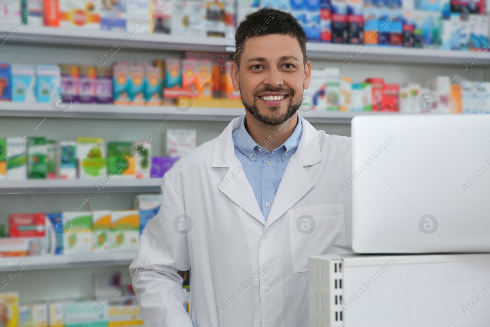 Photo of Portrait of professional pharmacist in modern drugstore