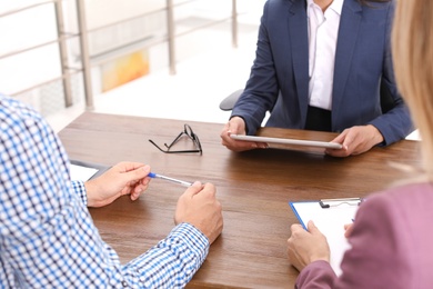 Human resources manager conducting job interview with applicants in office