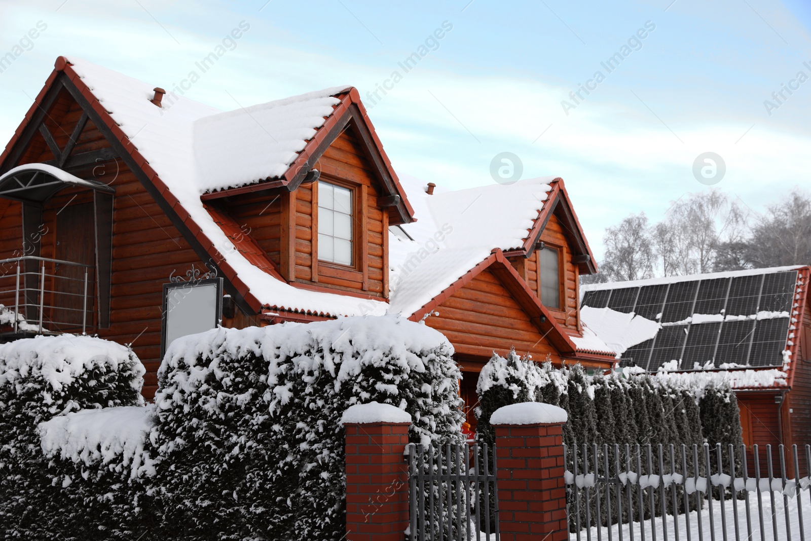 Photo of Winter landscape with beautiful houses, trees and bushes in morning