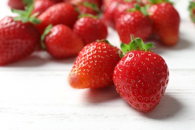 Ripe red strawberries on light background, closeup