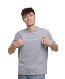 Young man wearing grey t-shirt on white background