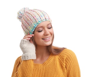 Photo of Young woman in warm sweater, mittens and hat on white background. Winter season