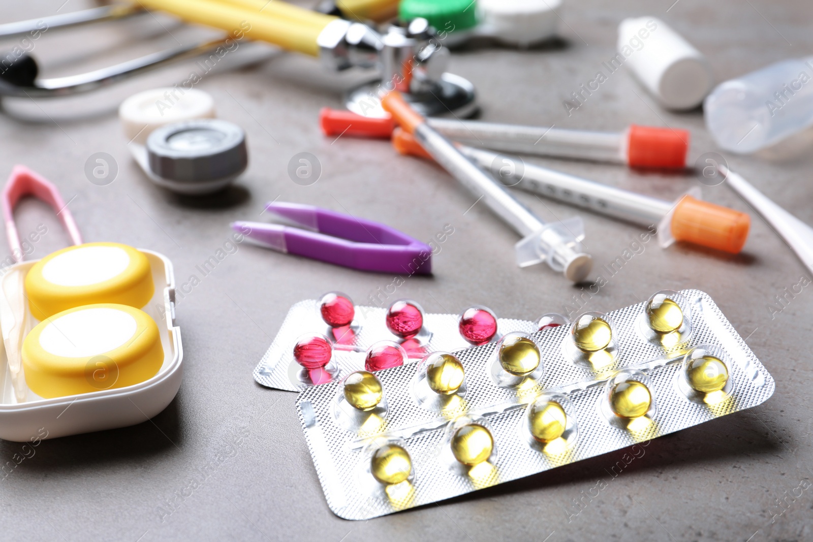 Photo of Set of medical objects on grey table