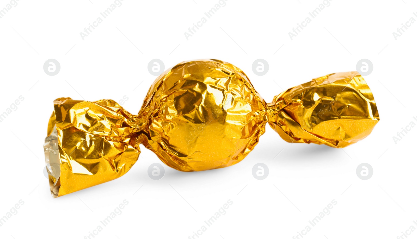 Photo of Tasty candy in yellow wrapper isolated on white