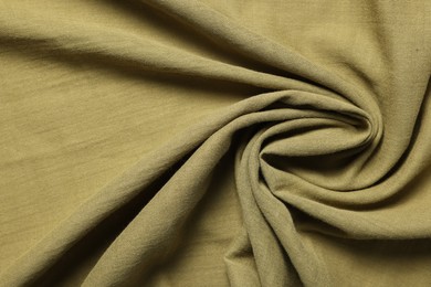 Photo of Texture of olive crumpled fabric as background, top view