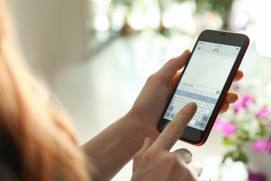 Photo of Woman writing message with text I Love You on smartphone against blurred background, closeup