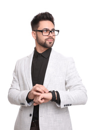 Young businessman checking time on white background