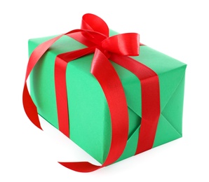 Photo of Christmas gift box decorated with ribbon bow on white background