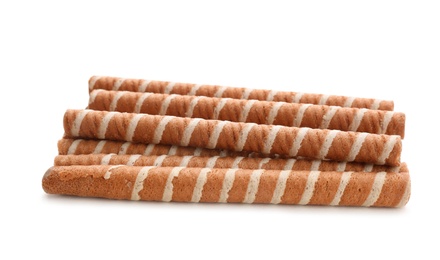 Tasty wafer roll sticks on white background. Crispy food