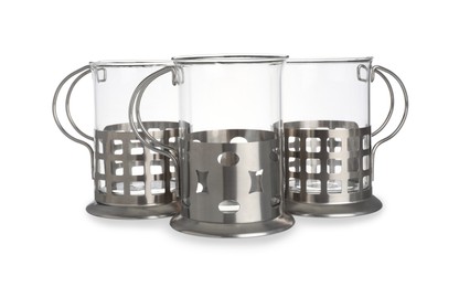 Photo of Traditional tea glass holders on white background