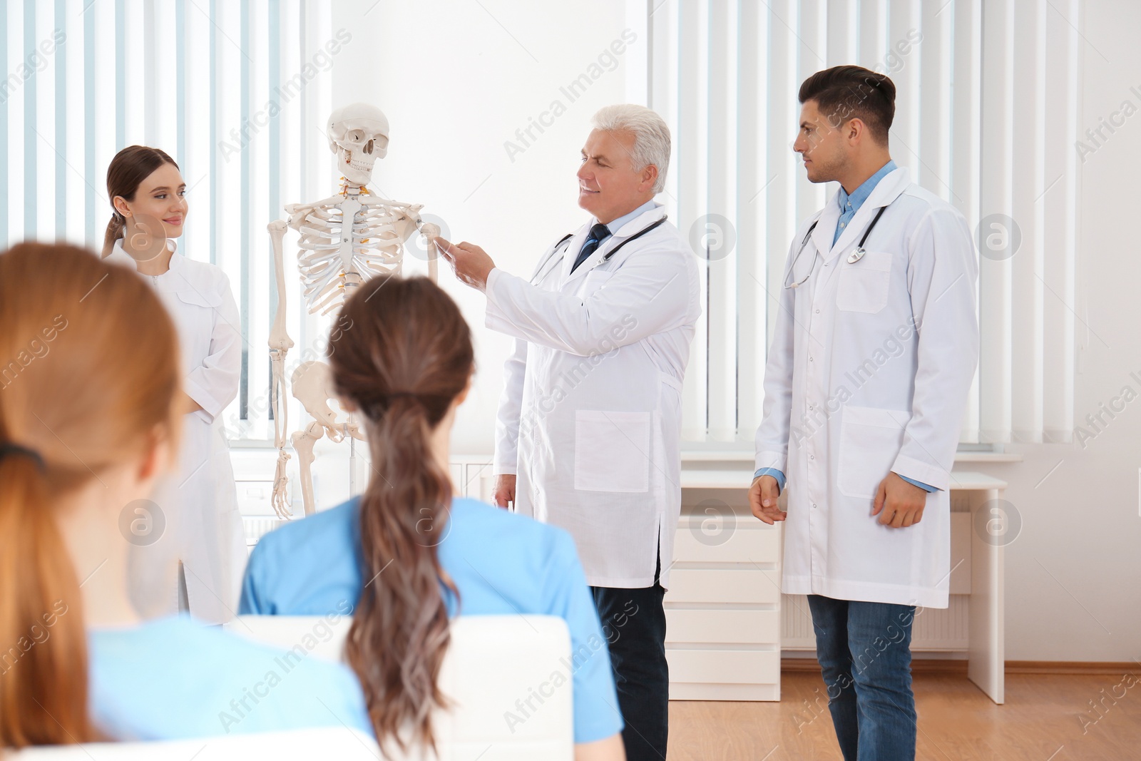 Photo of Medical students having lecture in orthopedics at clinic