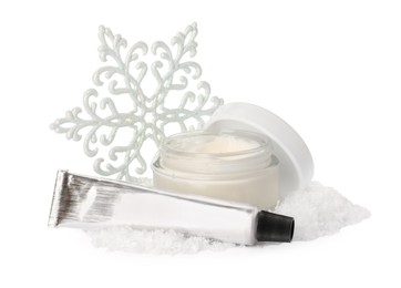 Photo of Setcosmetic products with hand cream and Christmas decor isolated on white. Winter skin care