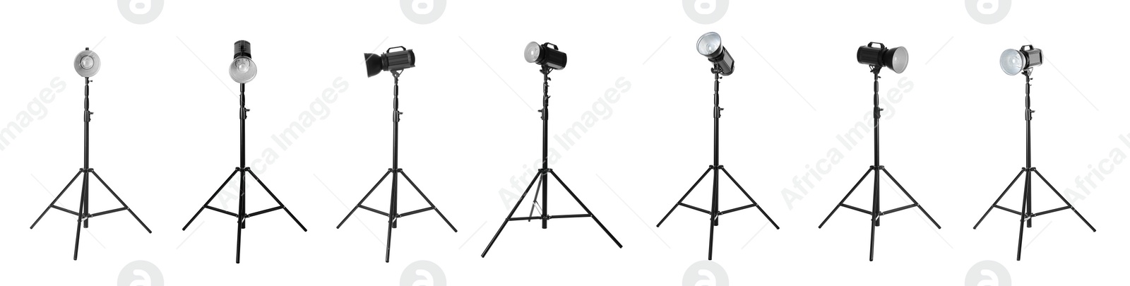 Image of Set with studio flash lights on tripods against white background. Banner design