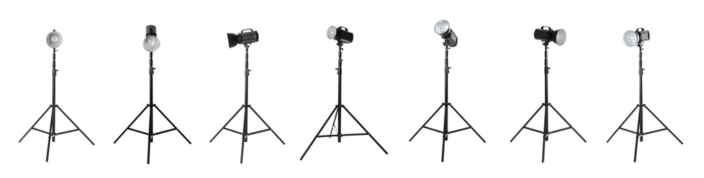 Image of Set with studio flash lights on tripods against white background. Banner design