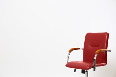 Comfortable office chair on white background, space for text