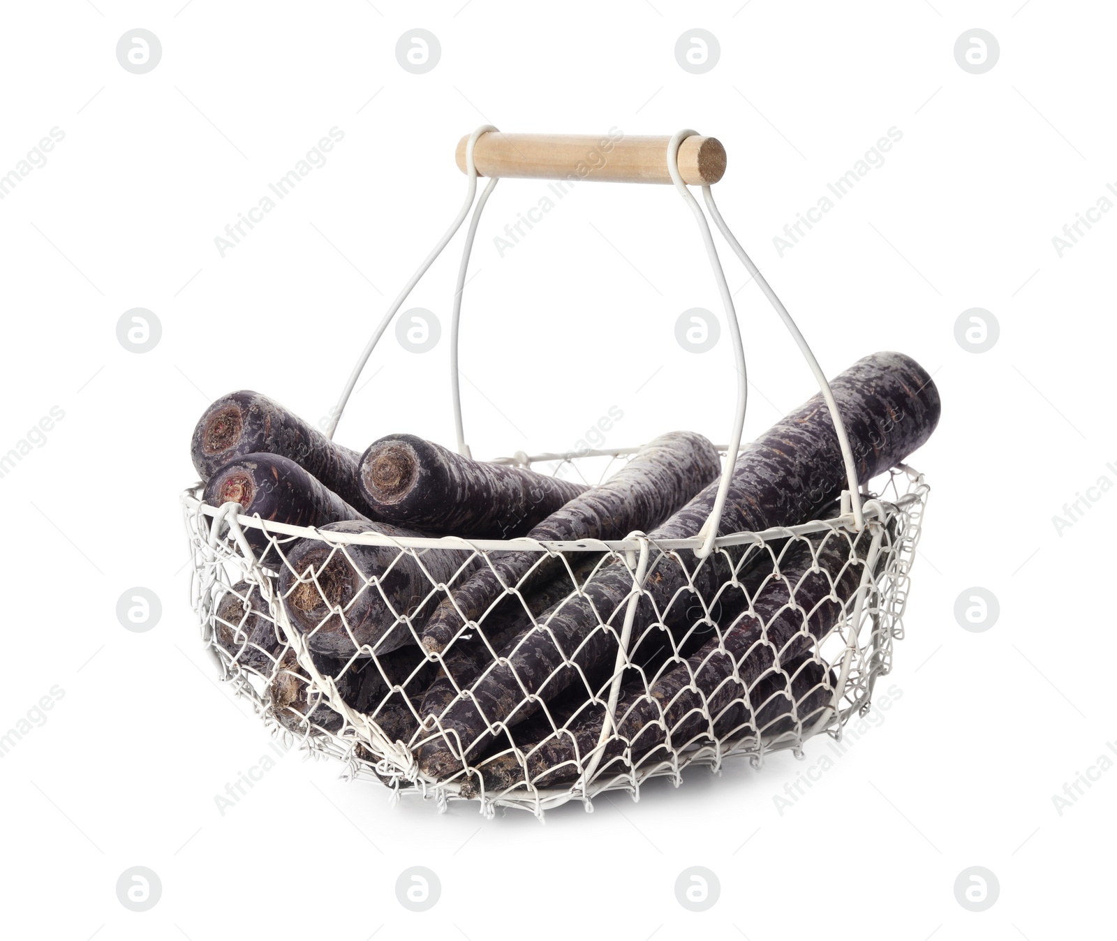 Photo of Raw black carrots in metal basket isolated on white