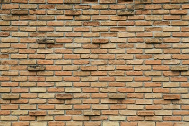 Photo of Texture of red brick wall as background, closeup