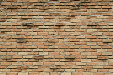 Texture of red brick wall as background, closeup