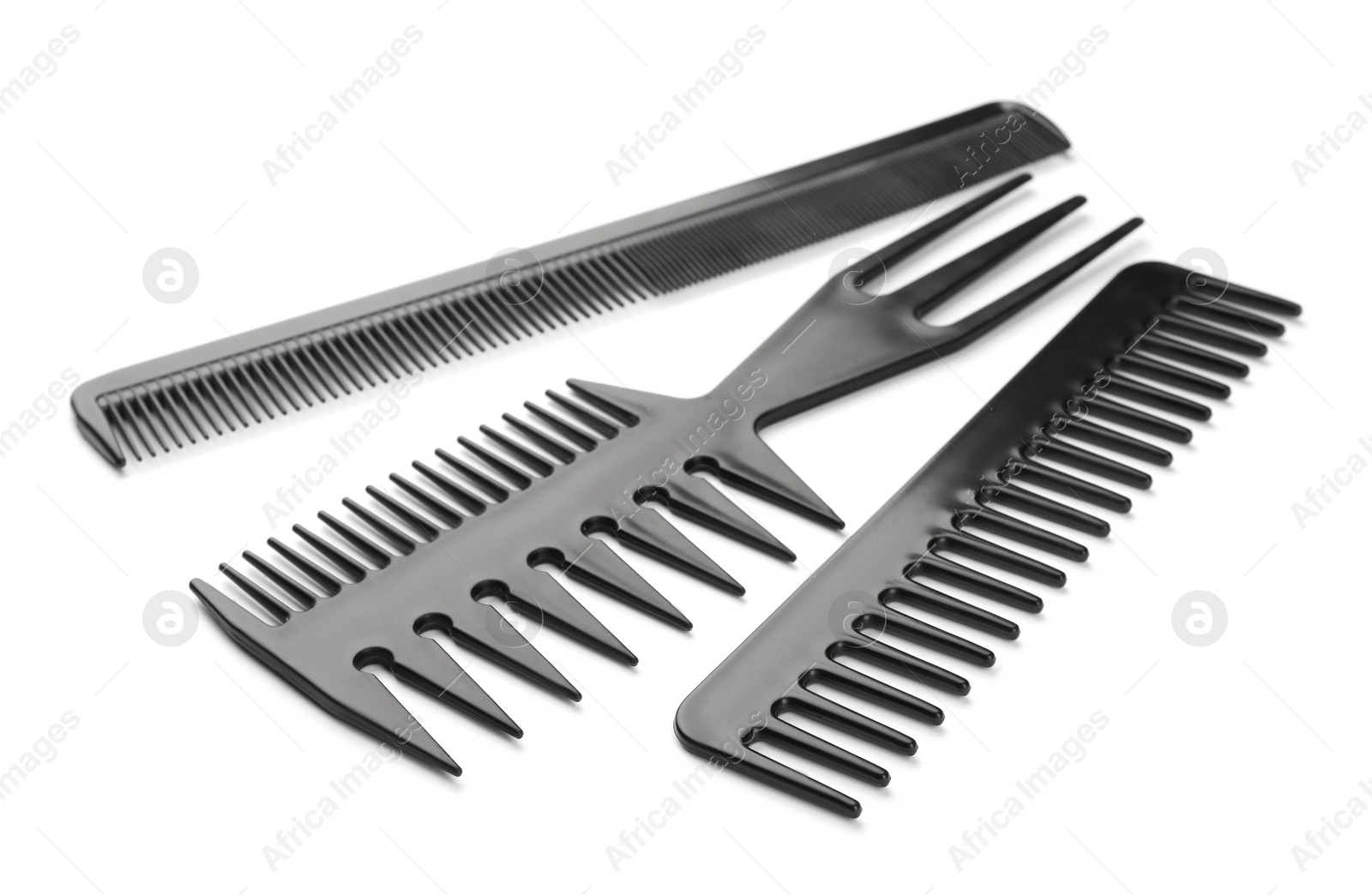 Photo of Set of new plastic combs isolated on white