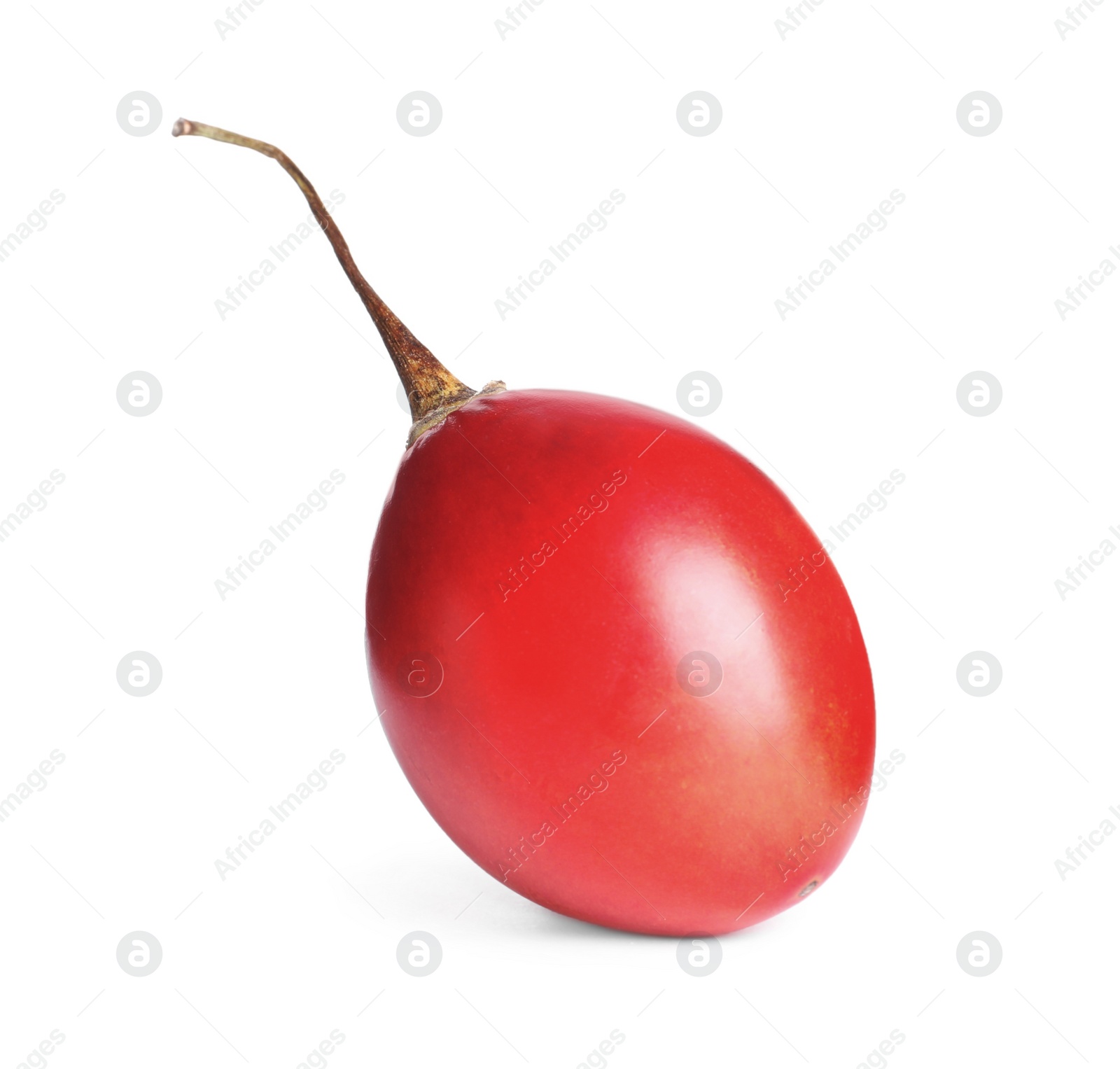 Photo of Delicious ripe tamarillo isolated on white. Exotic fruit