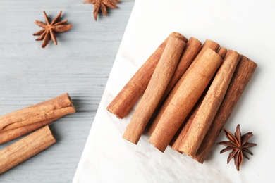 Aromatic cinnamon sticks and anise on marble board