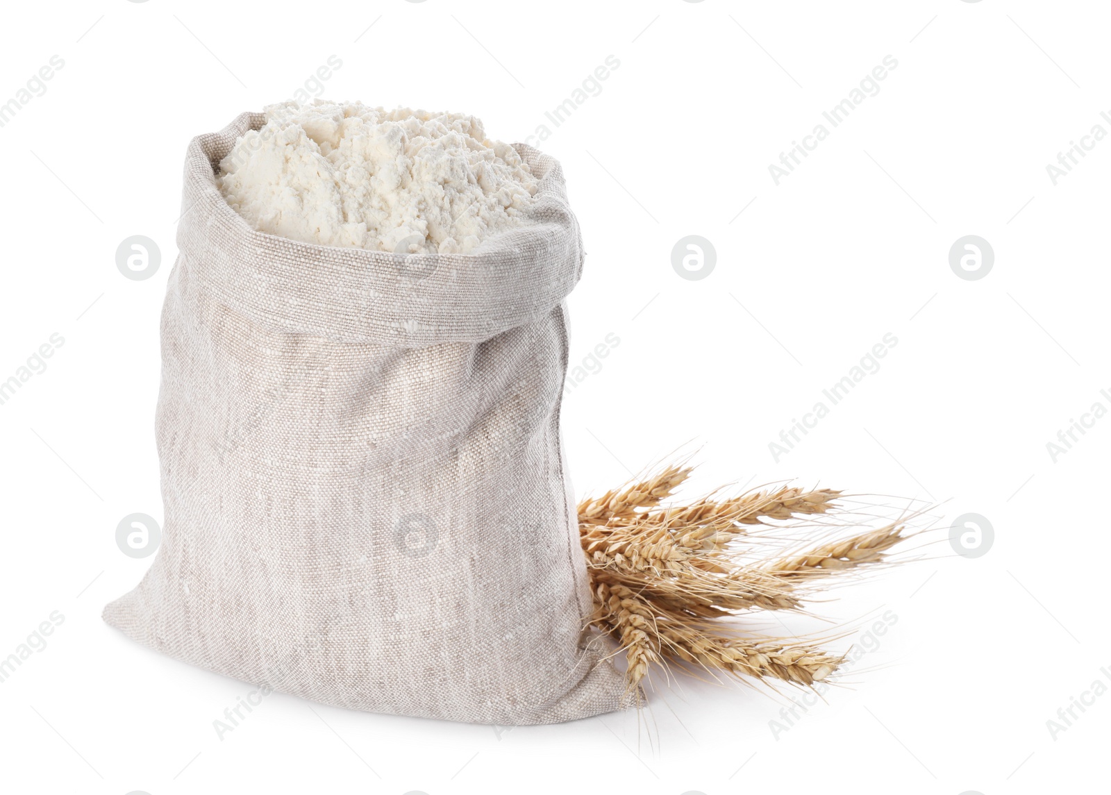 Photo of Sack with flour and wheat spikes on white background