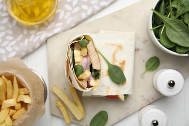 Photo of Delicious shawarma with chicken and fresh vegetables served on white wooden table, flat lay