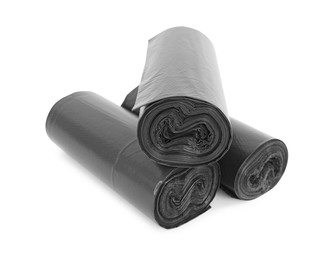 Rolls of black garbage bags isolated on white