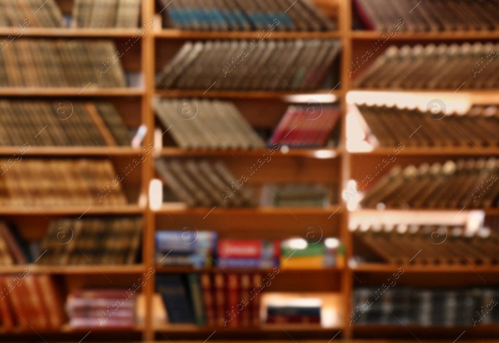 Photo of Blurred view of books on shelves in library