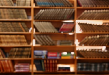 Photo of Blurred view of books on shelves in library