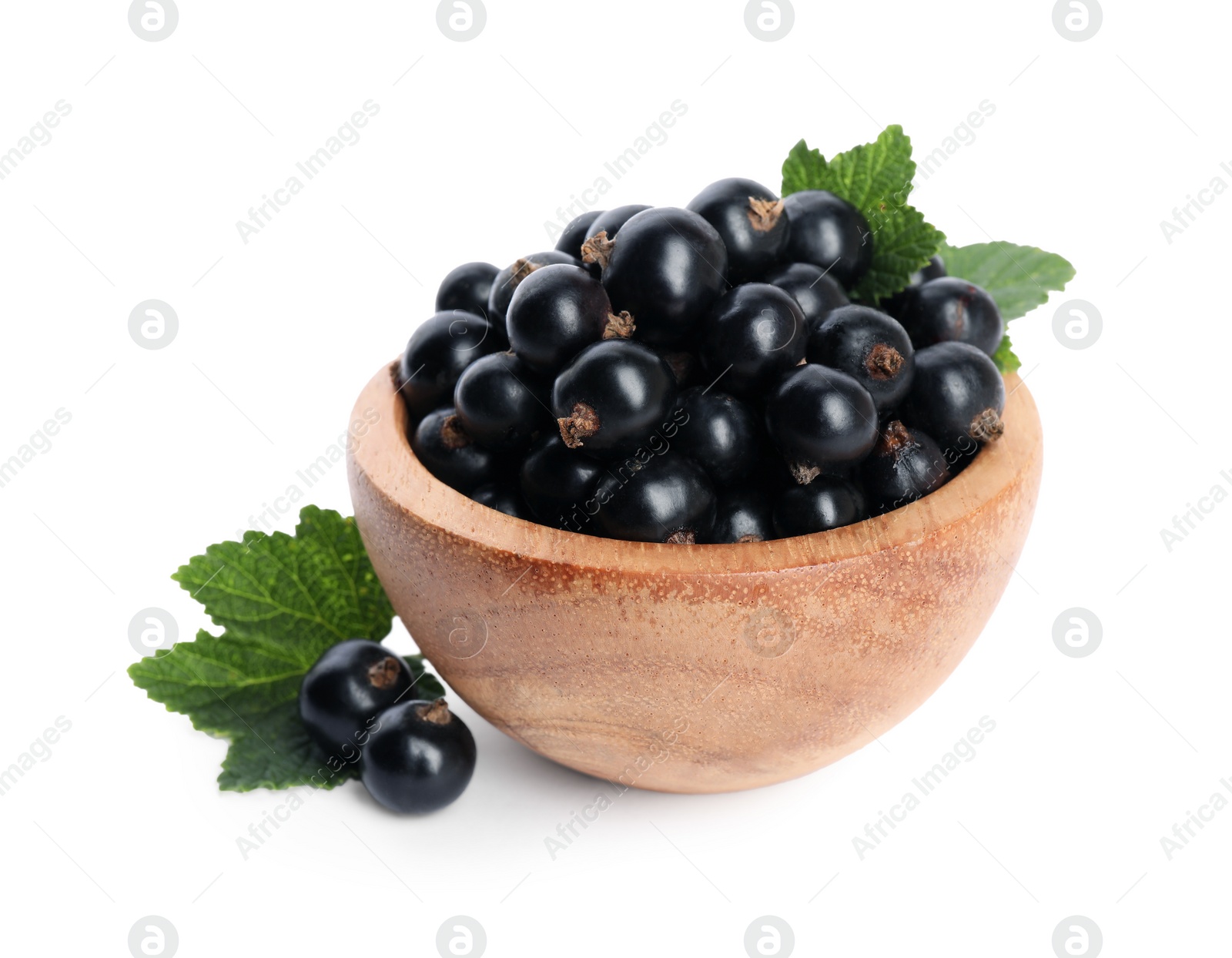 Photo of Ripe blackcurrants and leaves isolated on white