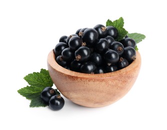 Ripe blackcurrants and leaves isolated on white