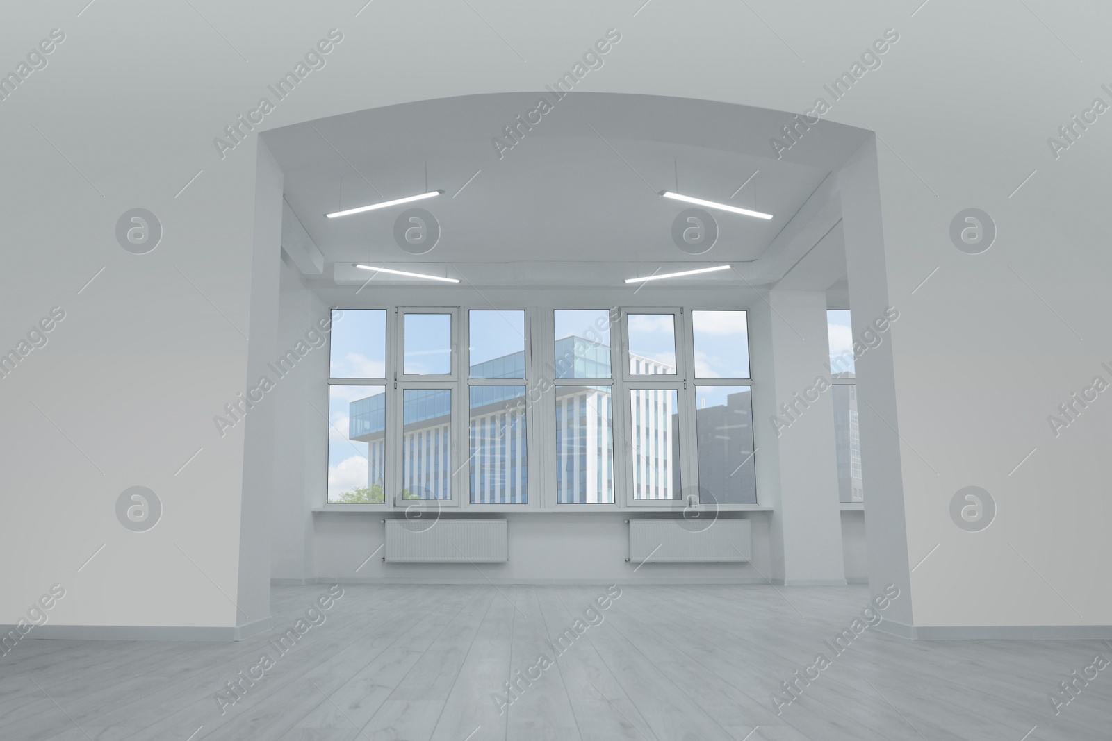 Photo of New empty room with clean windows and white walls