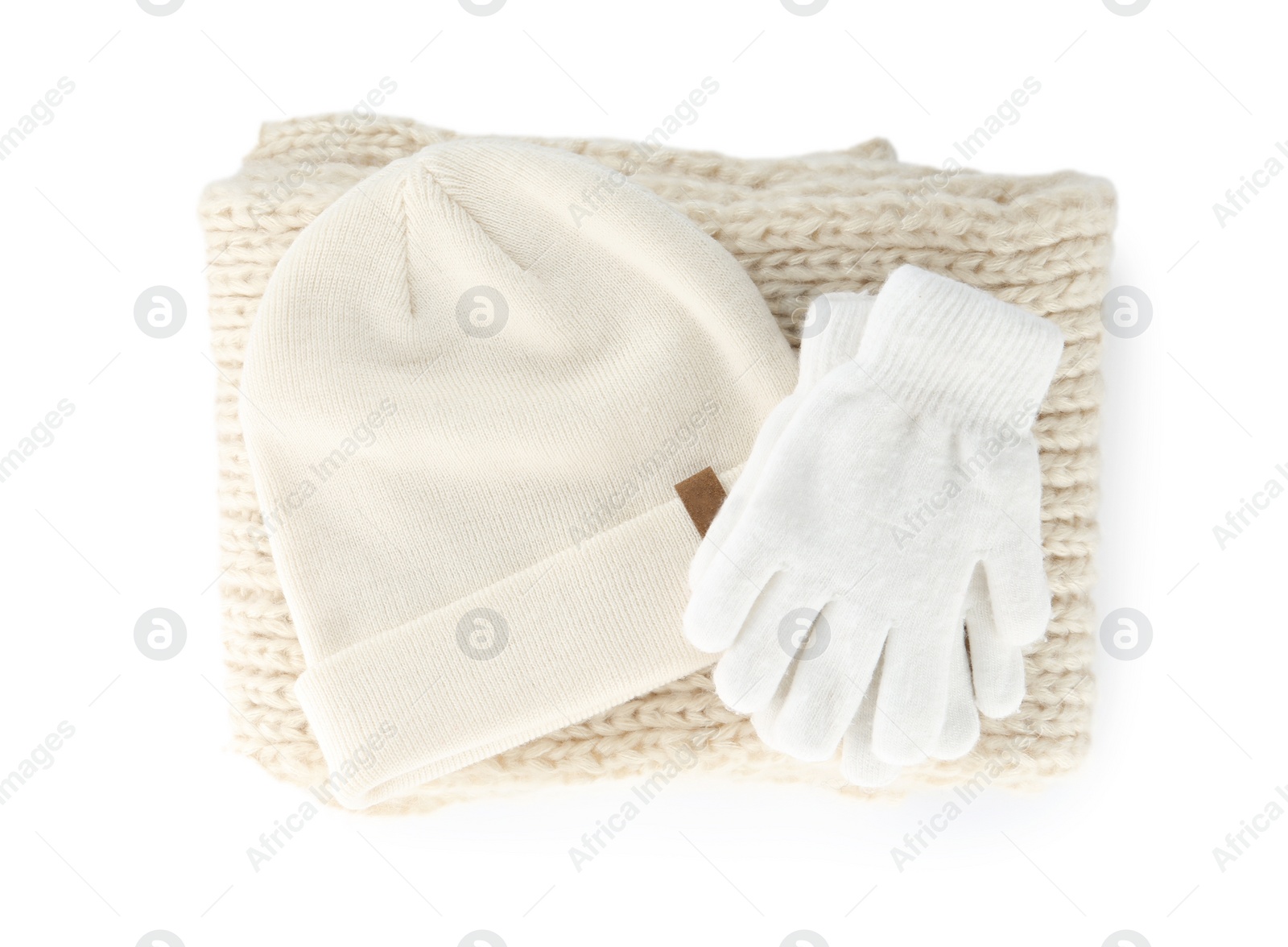 Photo of Woolen gloves, scarf and hat on white background, top view