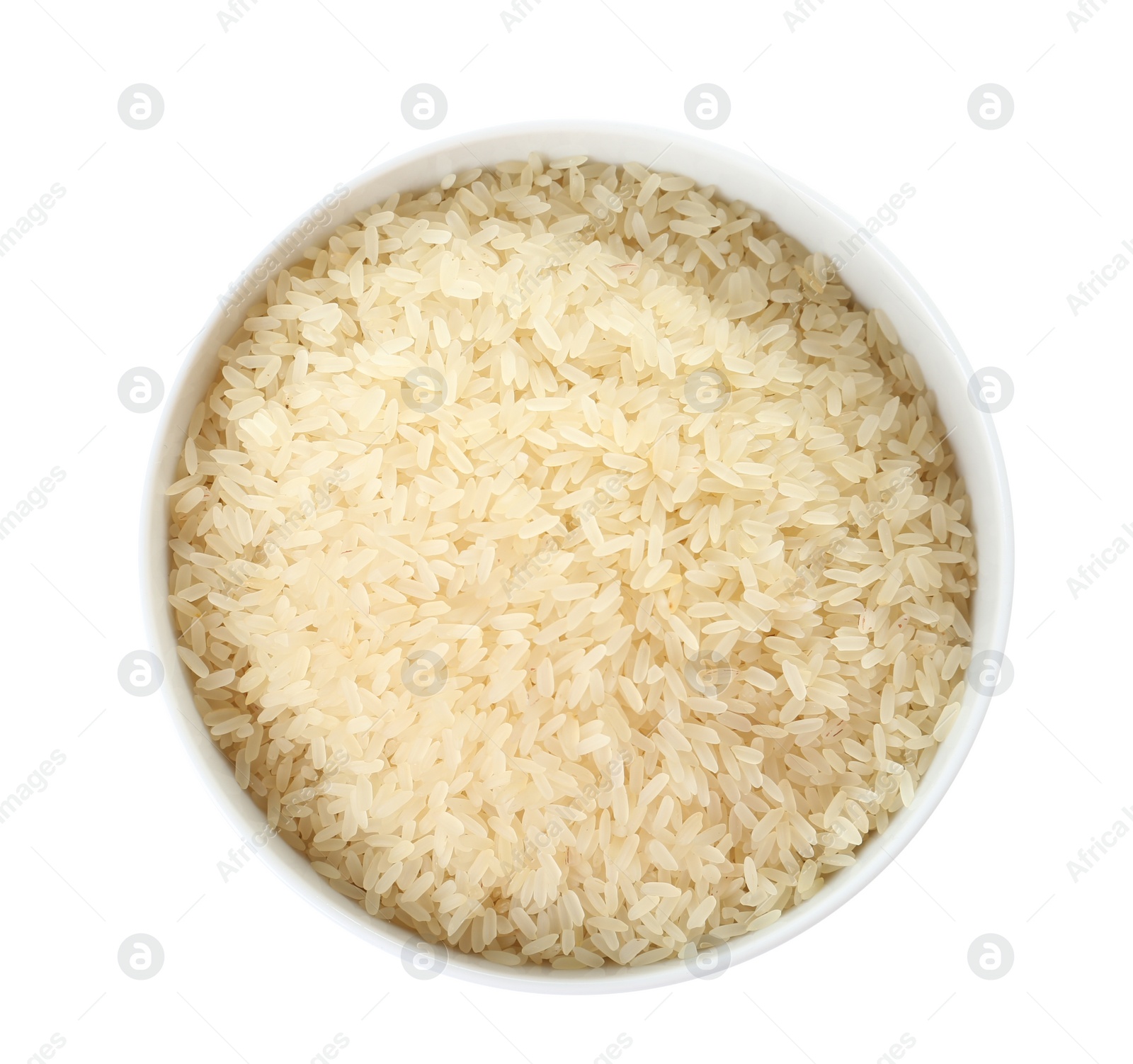Photo of Bowl with uncooked parboiled rice on white background, top view