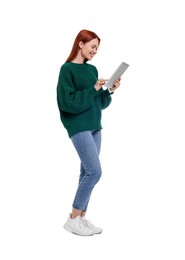 Photo of Happy woman using tablet on white background