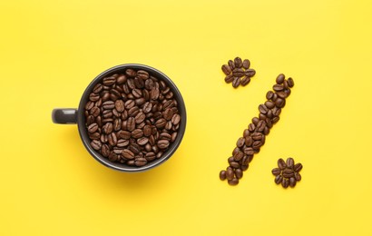 Photo of 0 percent made of cup and coffee beans on yellow background, flat lay. Decaffeinated drink
