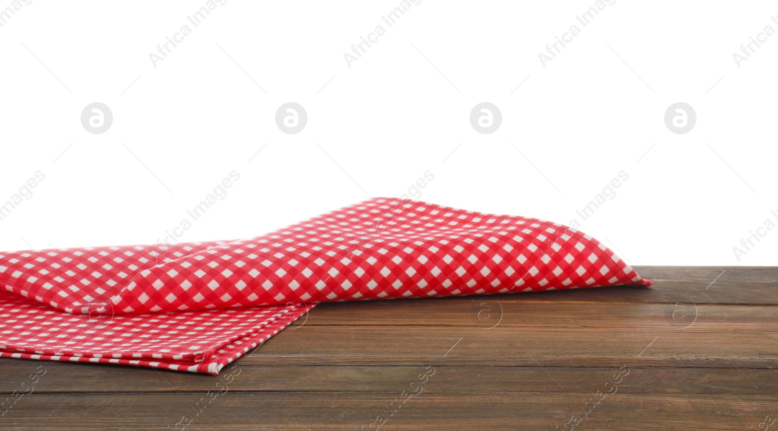 Photo of Red checkered cloth on wooden table against white background. Mockup for design