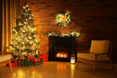 Photo of Beautifully wrapped gift boxes under Christmas tree in living room