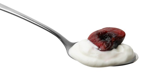 Photo of Spoon with yogurt and cherry isolated on white