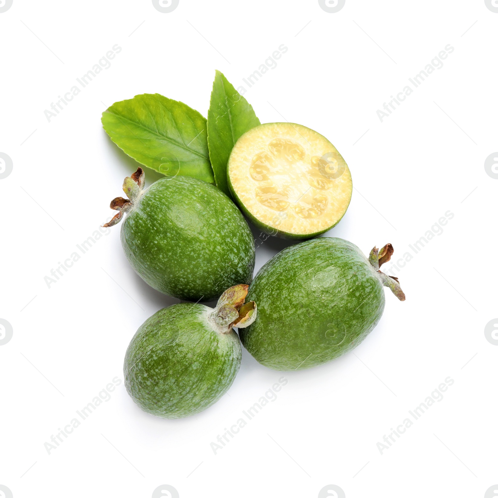 Photo of Cut and whole feijoas with leaves on white background, top view