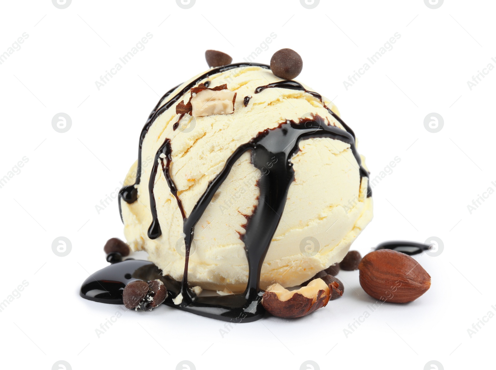 Photo of Ball of delicious vanilla ice cream with toppings on white background