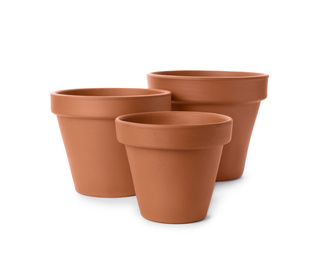 Stylish terracotta flower pots isolated on white